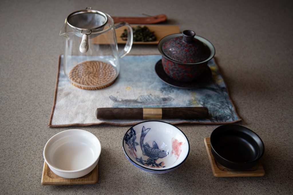 a table with dishes and a tea kettle